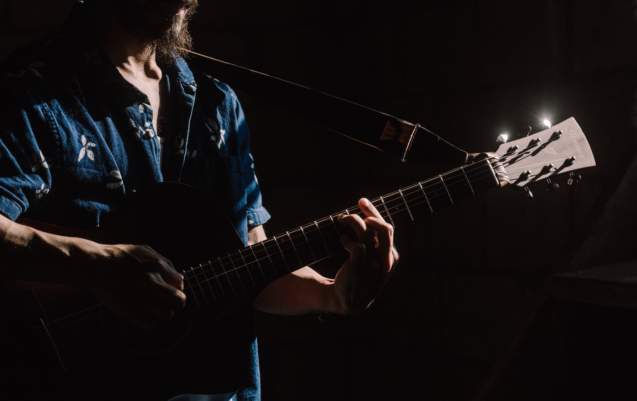 Cesar Cruz playing acoustic guitar live